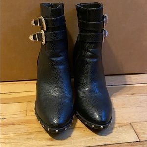 Studded and buckled leather look boots